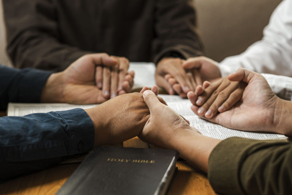 A group of young Christians working together to pray and seek bl